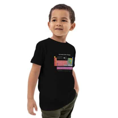 Child wearing a black periodic table t-shirt