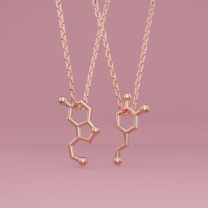 Serotonin + dopamine molecule necklaces in rose gold